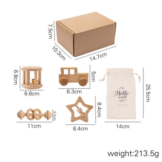 Montessori wooden baby rattle set – baby holding a wooden rattle – Bambelou UK