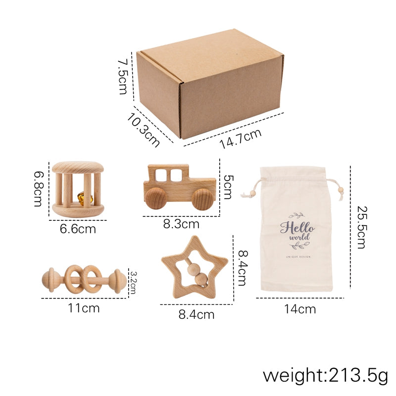 Montessori wooden baby rattle set – baby holding a wooden rattle – Bambelou UK