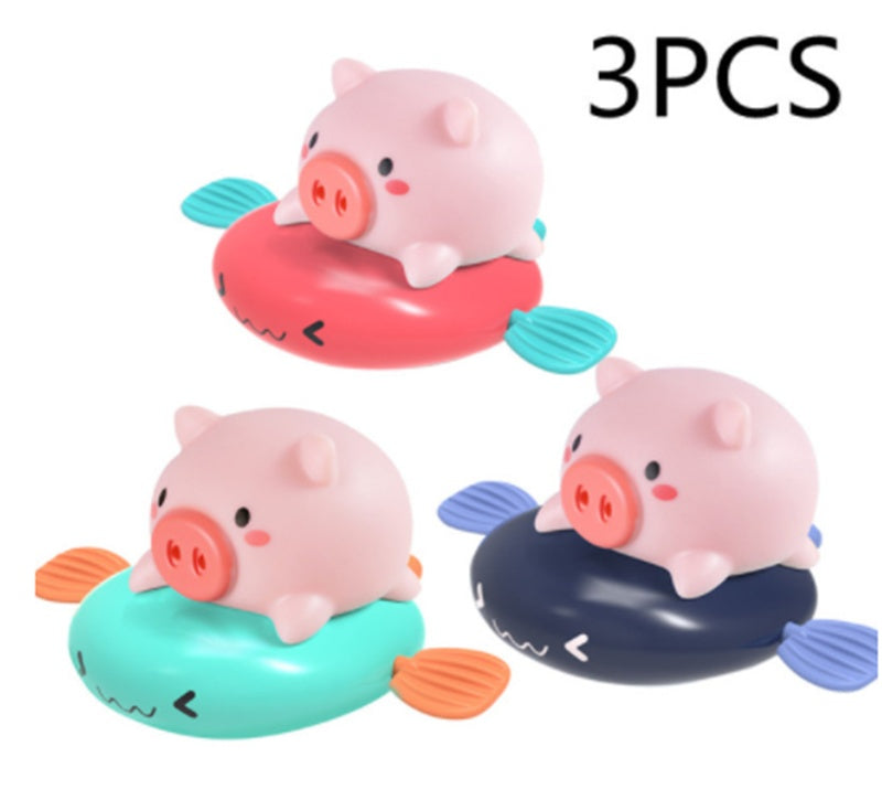 Wind-up swimming pig bath toy – size comparison view – Bambelou UK